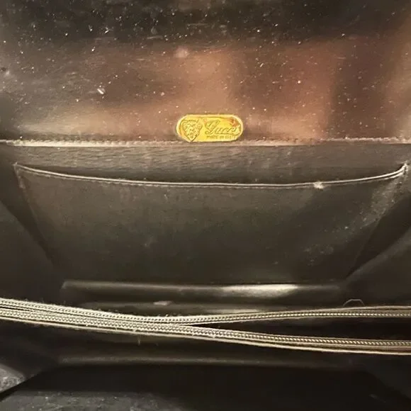 Gucci Black and Gold Leather Clutch